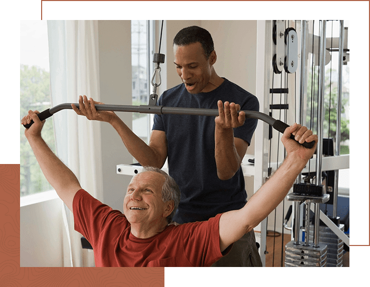 Senior man with stretch band in fitness